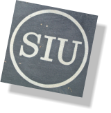 close up of silk screened logo on hand painted sign